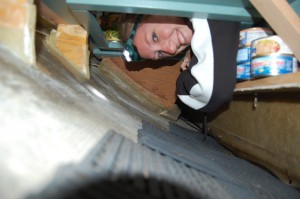Emily working in one of the boat's lockers