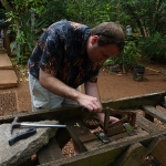 Jed showing how to crack a macadamia nut