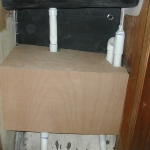 The tank installed, plumbed, and the wood covering being test fit