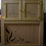 The finished cabinet doors and wood art